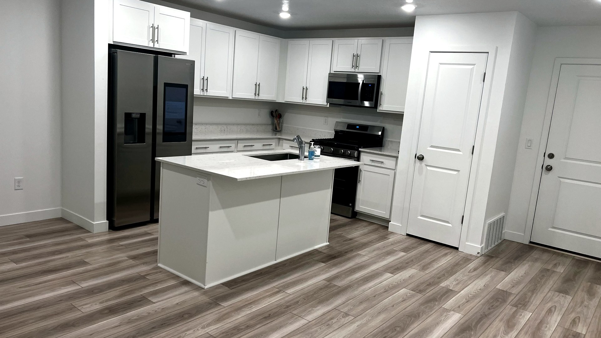 Bright clean home entry and kitchen by Sun Ray Cleaning Services